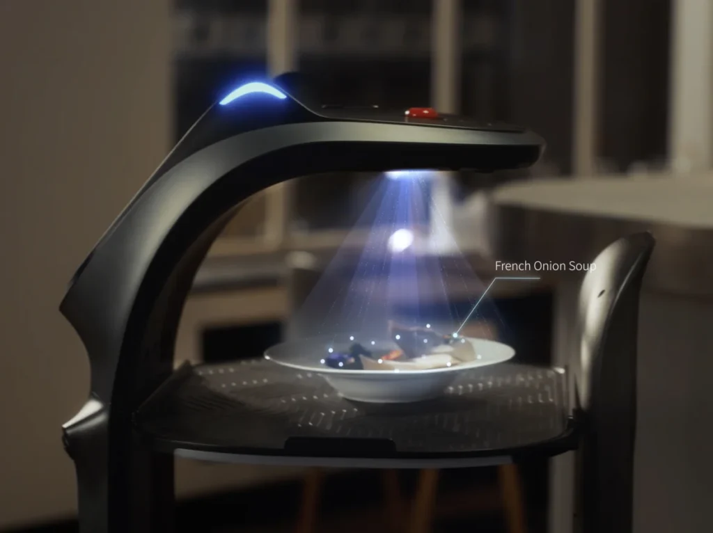 หุ่นยนต์ BellaBot Pro ใช้เซนเซอร์ส่องสแกนเพื่อจดจำเมนูอาหารบนถาดเสิร์ฟ